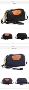 Vista detallada de bolsos bandolera de cuero multicapa en negro y azul con herrajes dorados