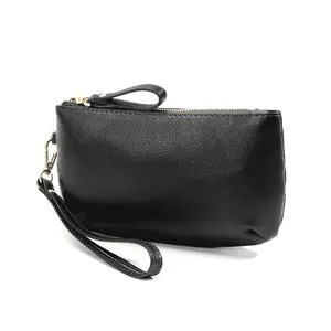 Minimalist black pebbled leather long wallet with gold zipper and wristlet strap