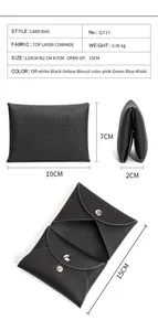 Detail view of leather card holder showing internal compartments and snap button closure