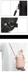 Detail of silver hardware and litchi grain leather on this two-layer crossbody phone bag