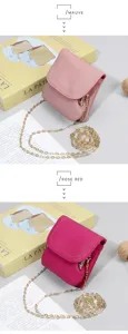Detailed view of textured mauve and rose red leather mini bags with gold chains
