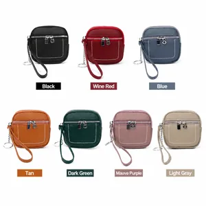 Mini portamonete in vera pelle con cerniera e portachiavi in sette colori assortiti