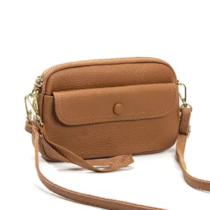 Brown litchi grain genuine leather crossbody bag with golden zipper and button flap pocket