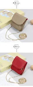 Mini leather coin purses in grey and red with pebble grain texture and gold chains