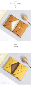 Detail of envelope leather card holder in biscuit and yellow with pebble grain texture