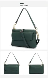 Détails du sac en cuir grainé vert foncé avec des finitions dorées et deux bandoulières