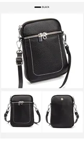 Macro detail of black pebble leather phone bag with white contrast stitching and silver hardware