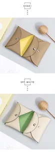 Detailed view of dual-color leather coin purses with khaki and off-white pebble textures