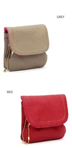Detailed front view of leather coin purses in grey and red with contrast stitching and chain