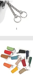 Detail of multi-color leather car key cases with double rings and zipper closure