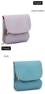 Front view of mini lychee leather coin purses in light purple and blue with gold chains