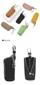 Detail view of leather car key case showing inner anti-lost chain and rotating metal hook