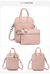 Detailed view of Peony Pink pebble leather crossbody phone bag set with detachable strap