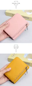 Kurze Ledergeldbörse in Rosa und Gelb mit silbernem Reißverschluss und bifold Design