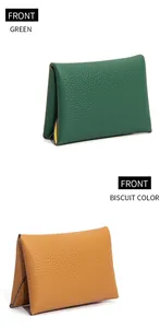 Detailed front view of green and biscuit leather mini wallets with soft pebbled texture