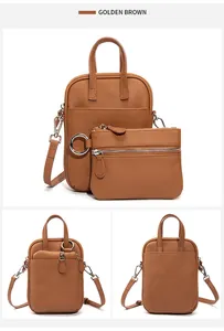 Detail of golden brown lychee leather crossbody bag with detachable coin purse and silver hardware