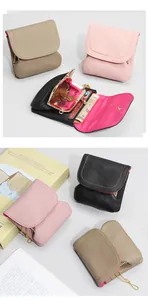 Close-up of leather coin purse interior with card slots and vintage metal kiss-lock