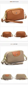 Bolsos de muñeca con doble cremallera en cuero amarillo tierra y gris claro granulado