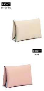 Front view of mini leather coin purses in off-white and pink with pebbled texture
