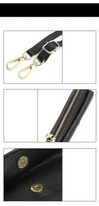 Detail of black lychee grain leather crossbody bag with gold zippers and hardware
