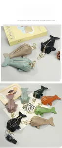 Litchi pattern leather whale pouches with gold zippers in multiple vibrant colors