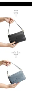 Vertical view of black and denim blue leather bags with gold hardware and strap