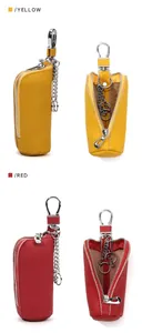 Detail of red and yellow leather car key cases with silver zippers and swivel hooks