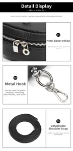 Detail of smooth metal zipper, silver swivel hook, and detachable leather strap on black bag