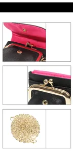 Detail of black pebbled leather mini purse with gold clasp and pink lining