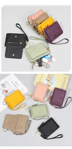 Macro shot of multi-color genuine leather wallets with pebbled texture and metal key ring