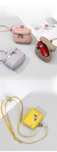Mini cowhide leather crossbody coin purse detail showing pink, purple, and khaki options
