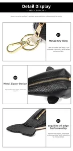 Close-up of black lychee grain leather whale pouch with golden hardware and zipper
