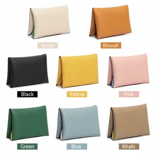 Mini genuine leather coin purse available in eight colors with a pebbled texture finish