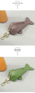 Detail of whale-shaped leather key pouches in lotus root purple and green colors