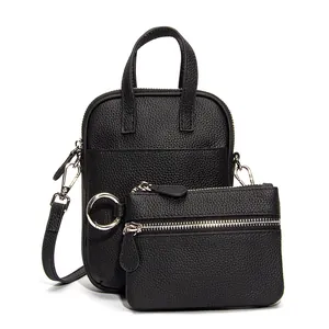Vertical black genuine leather crossbody bag with small coin purse and silver hardware