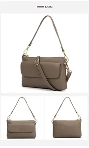 Detail view of khaki genuine leather crossbody bag with lychee texture and gold zippers
