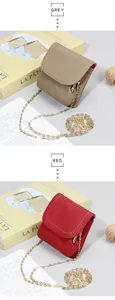Detail of genuine leather mini coin purses with lychee texture and gold chain straps