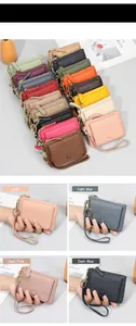 Detailed view of colorful pebble leather coin purses with wristlet and gold key ring