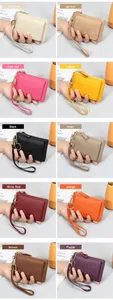Macro view of ten colorful lychee grain leather mini wallets with wristlet straps