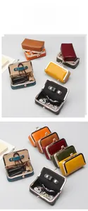 Macro view of oil wax leather jewelry case with vintage metal clasp and plush lining
