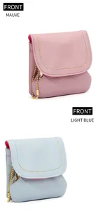 Detail of genuine leather coin purses with colorful stitching and golden chain
