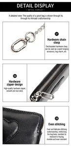Détail du porte-monnaie en cuir avec porte-clés en métal argenté et fermeture éclair robuste