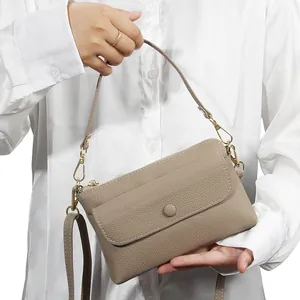 Minimalist genuine leather crossbody phone bag with pebble texture and gold zippers