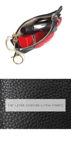 Detail of cowhide coin purse with litchi texture and heart charm, fits a lipstick
