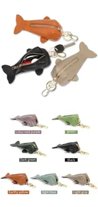Detailed view of leather fish-shaped key pouches in multiple colors with gold hardware