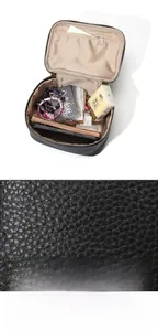 Détail du sac à main en cuir grainé noir avec intérieur spacieux et poche zippée