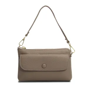 Front view of a brown genuine leather crossbody phone bag with lychee texture