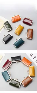 Macro shot showing retro oil wax leather mini bags with vintage metal kiss lock closure