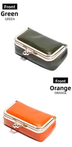 Front view of vintage oil wax leather kiss-lock mini jewelry pouch in green and orange