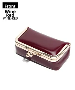 Front view of a wine red vintage leather kiss-lock coin purse with polished metallic clasp